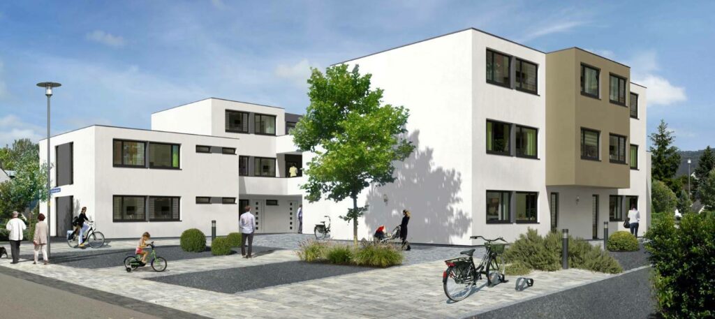 Zwei moderne Wohngebäude mit weißen Fassaden und Fenstern, umgeben von einem gepflasterten Außenbereich.